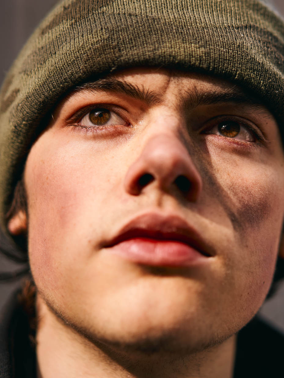 Closeup portrait of a young man with a visionary and very confident optimistic look on his face